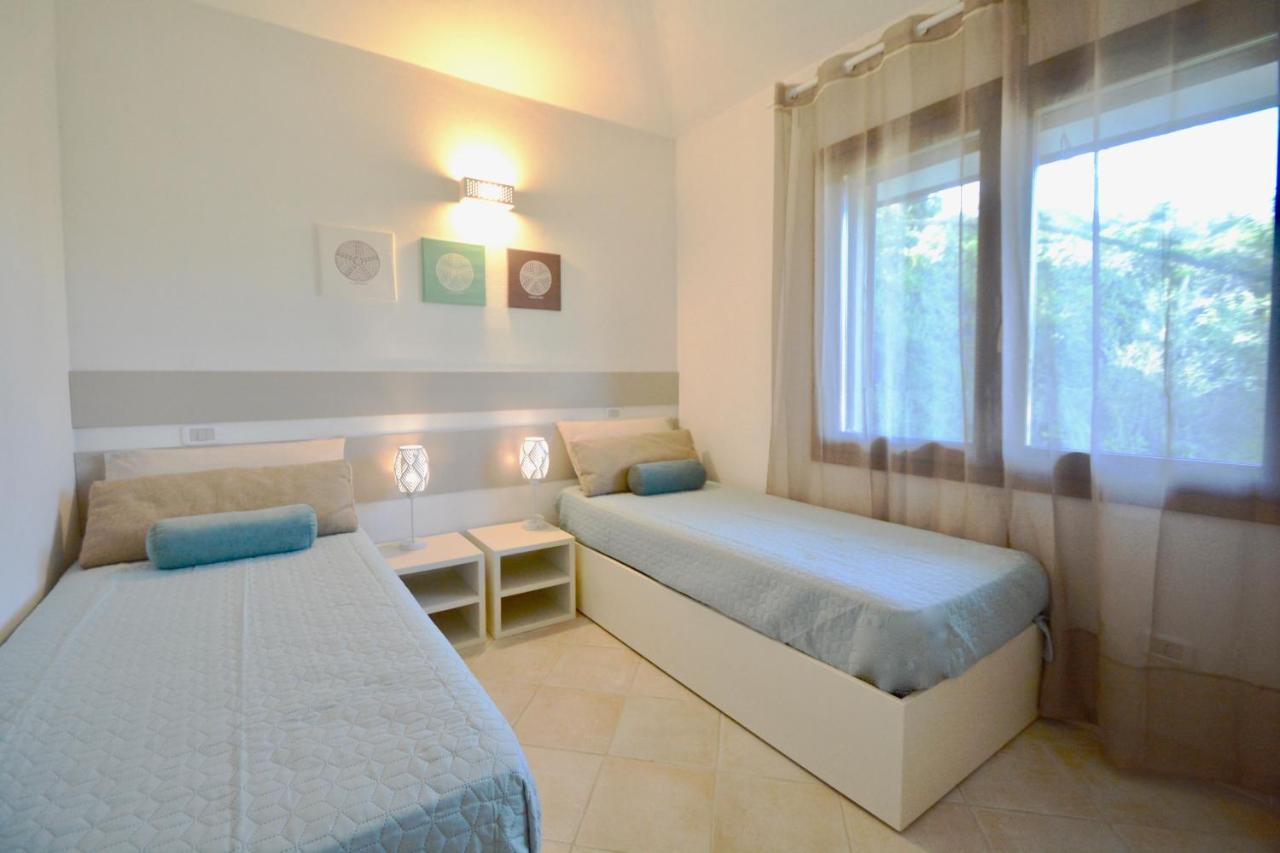 Case Sul Mare Residenze Di Bes Chia Exterior foto